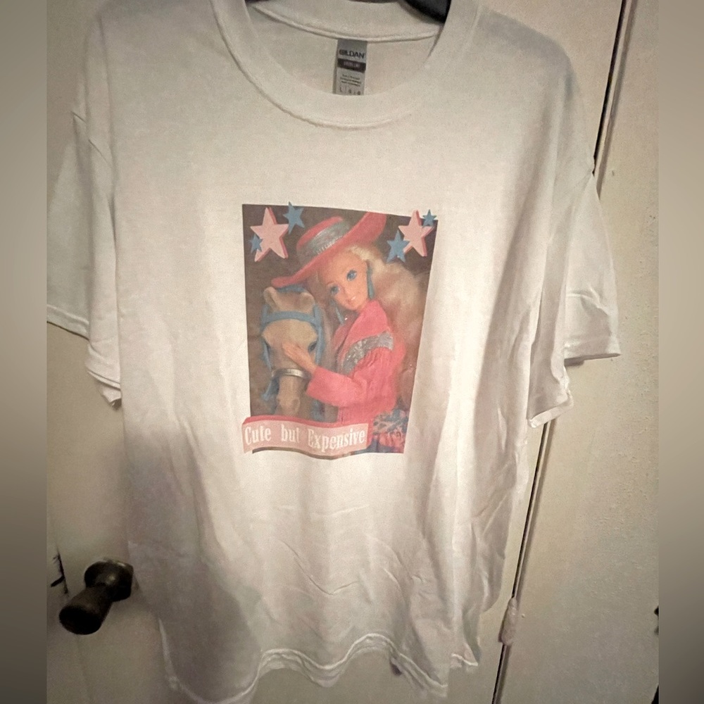NWOT The “Cute But Expensive” Graphic Western Pink Barbie Doll T-shirt